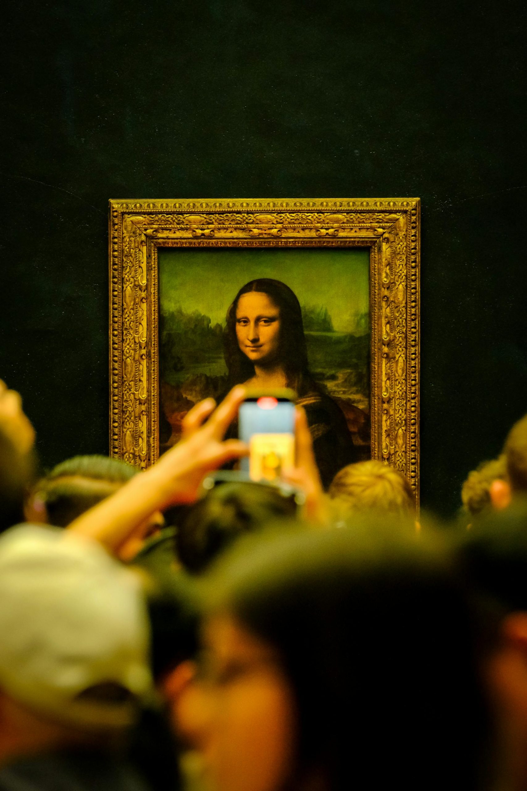 Tourist crowd at Mona Lisa in the Louvre in Paris